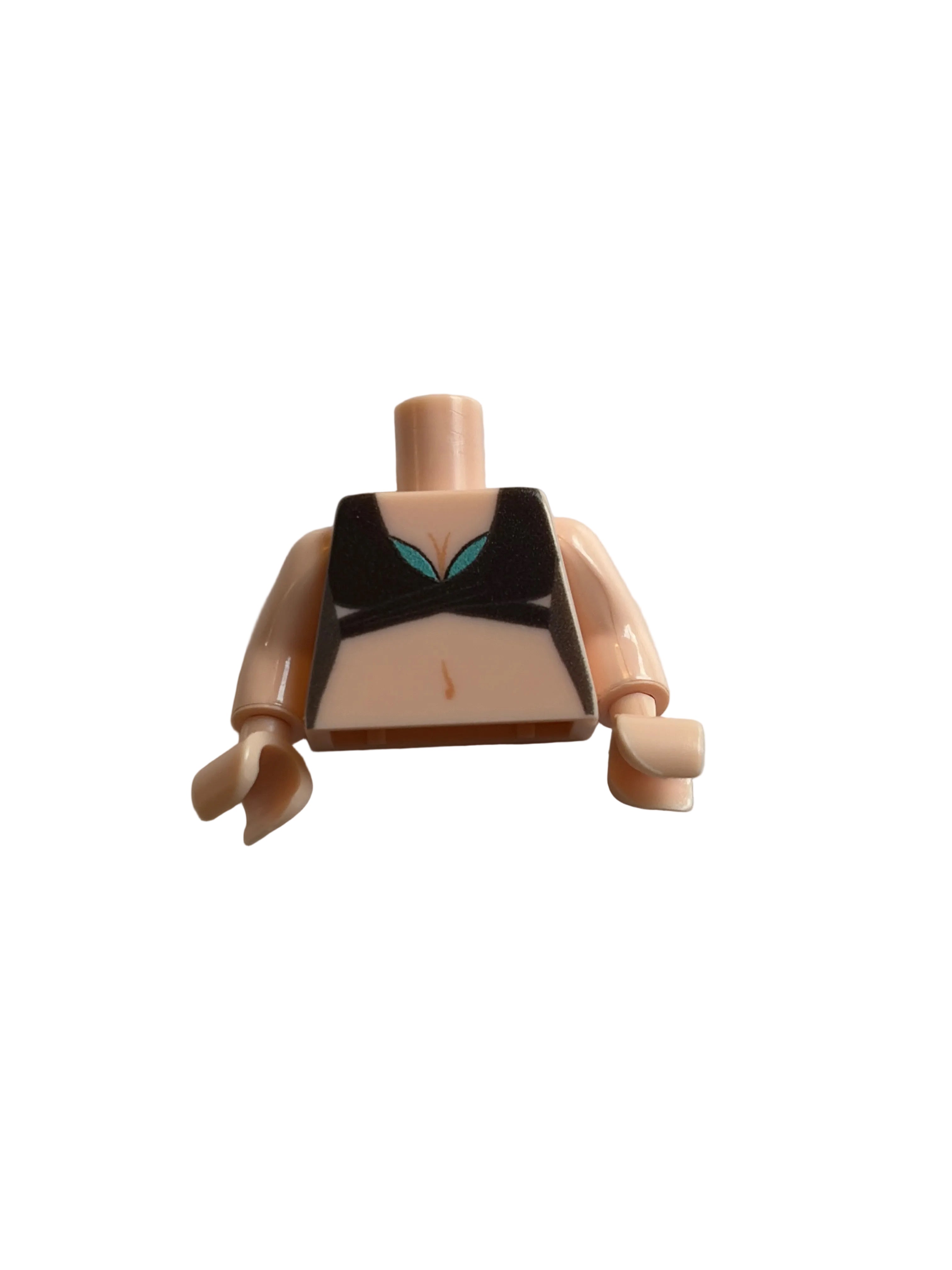 A single toy minifigure torso piece with beige skin-tone arms and legs, a black chest panel, and small teal and peach details, photographed on a plain light gray background.