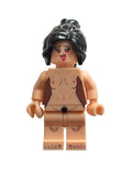A custom-built toy minifigure with a nude torso, black hair, and a distressed face, photographed against a plain off-white background.