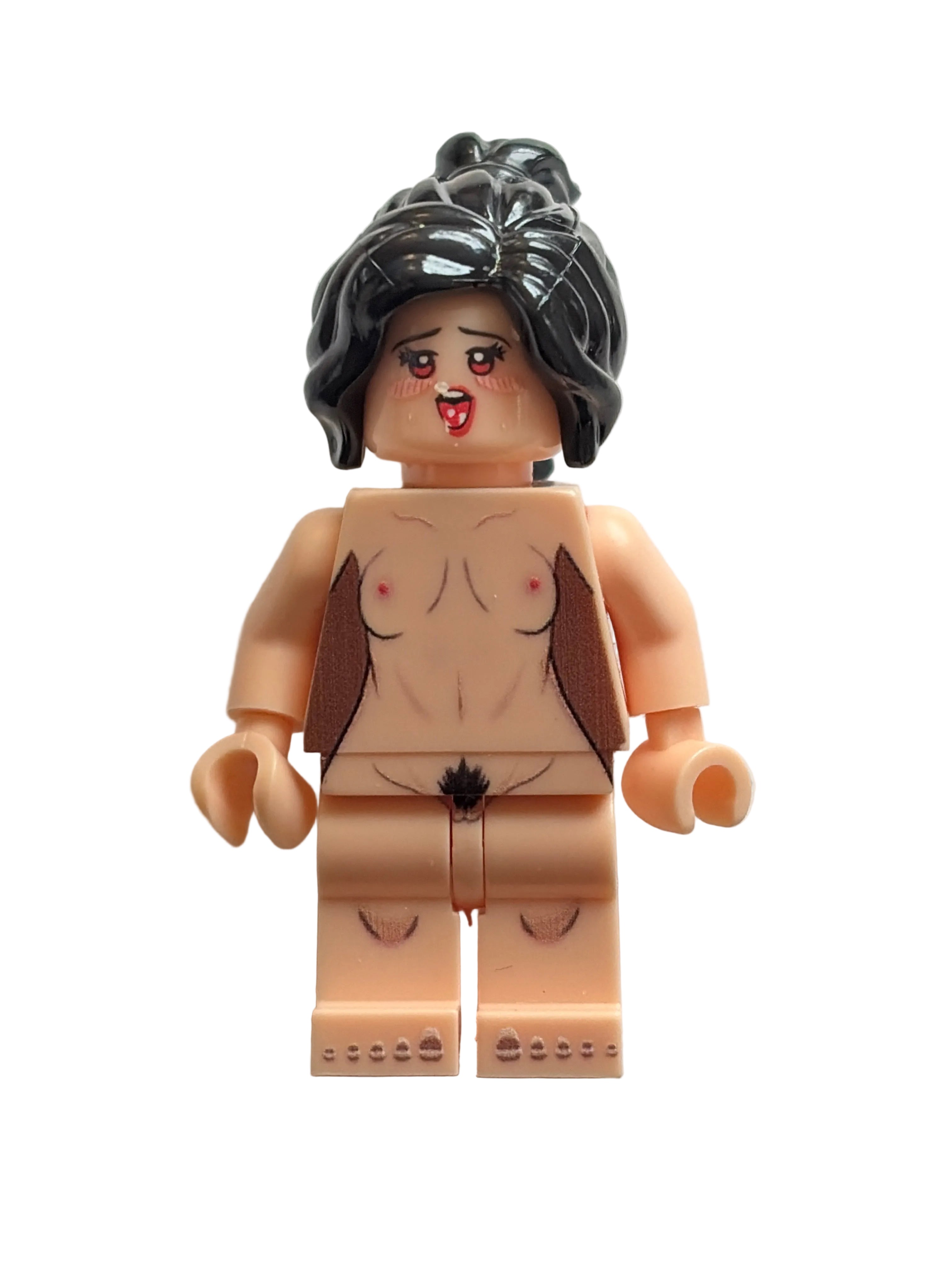 A custom-built toy minifigure with a nude torso, black hair, and a distressed face, photographed against a plain off-white background.