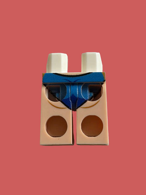 A single LEGO minifigure torso piece in light peach skin tone with a blue chest and white shoulders, photographed on a plain off-white surface.