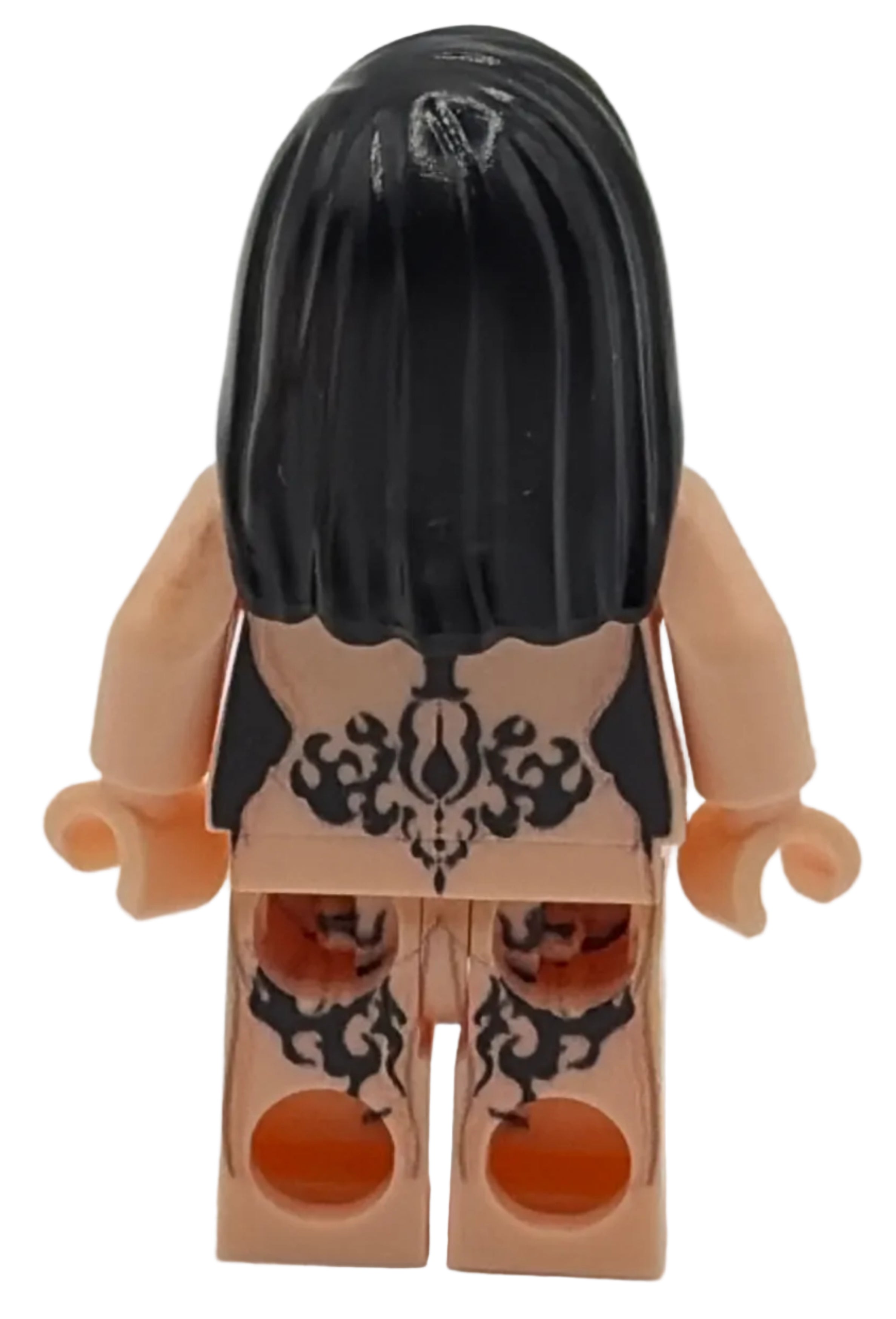 Toy figure with black hair and decorative headpiece on a white background