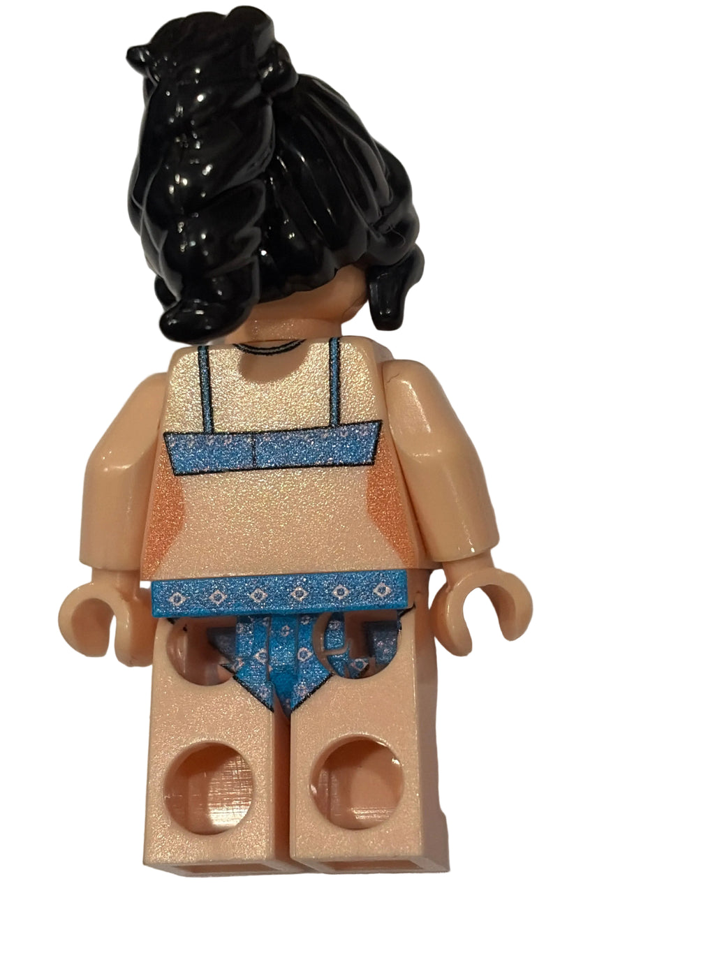 Toy figure with a black object on a white background