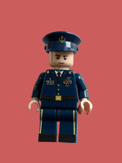 A custom United States military Air Force minifigure dressed in a dark blue military uniform with a matching peaked cap, shown against a plain white background.