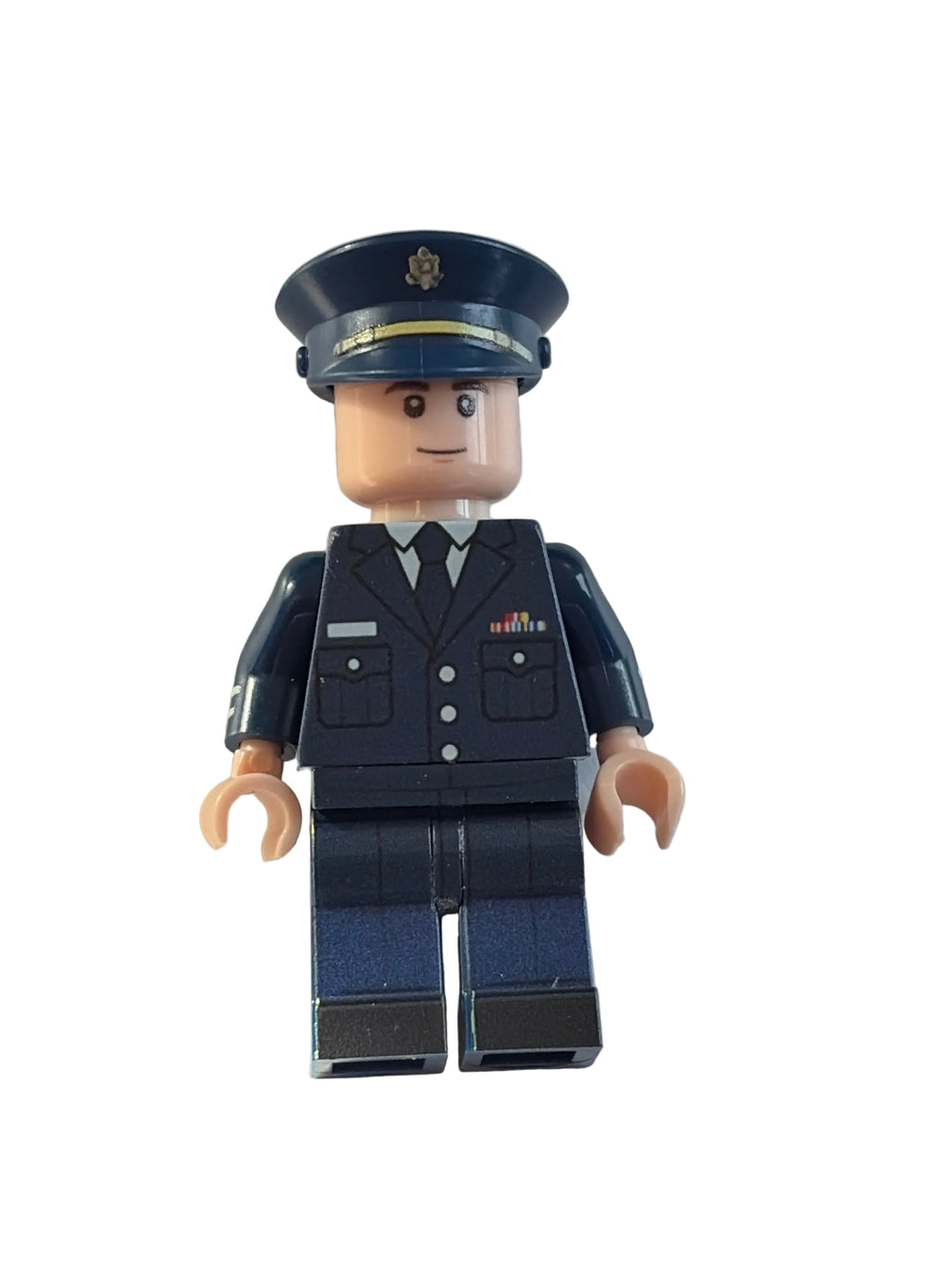 A toy minifigure dressed in a dark navy blue police uniform with a matching peaked cap, standing against a plain off-white background.