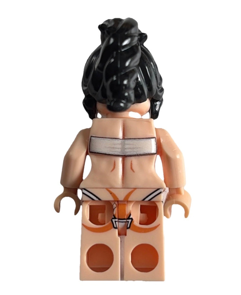 A back view of a custom LEGO minifigure with black hair, a beige skin tone, a white top, and orange patterned bottoms, isolated on a white background.