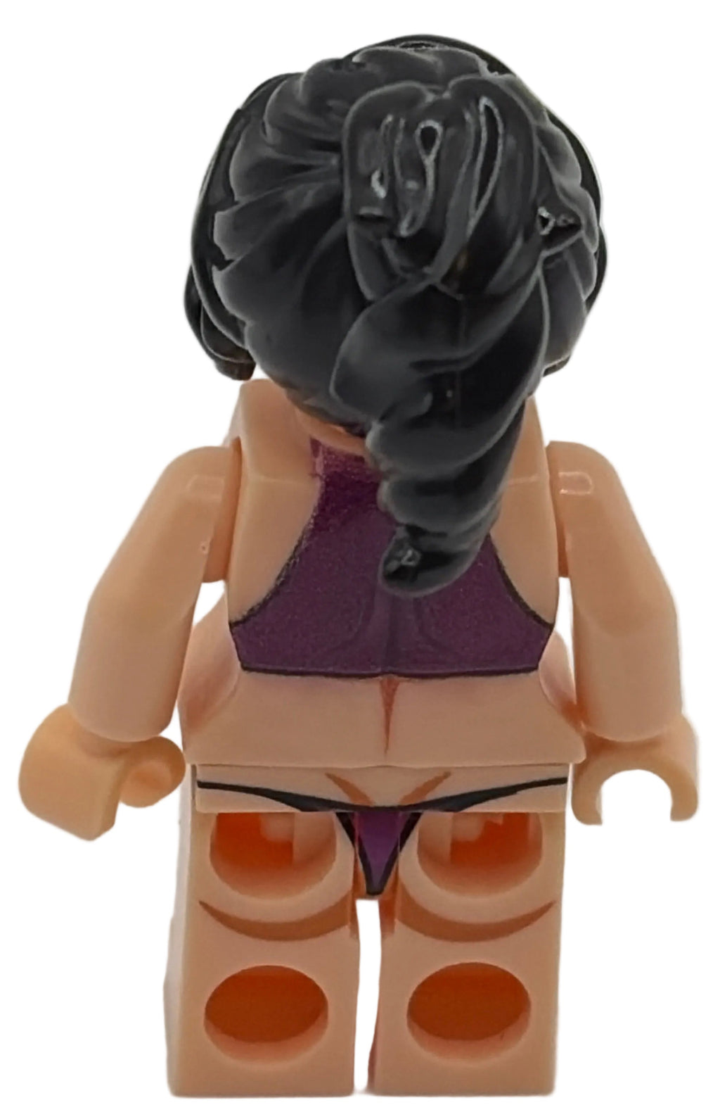 Toy figure with black hair and purple outfit on a white background