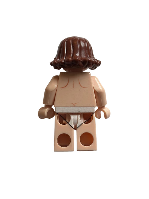 A toy minifigure torso with a brown wig and a rectangular back piece, photographed on a plain light background.