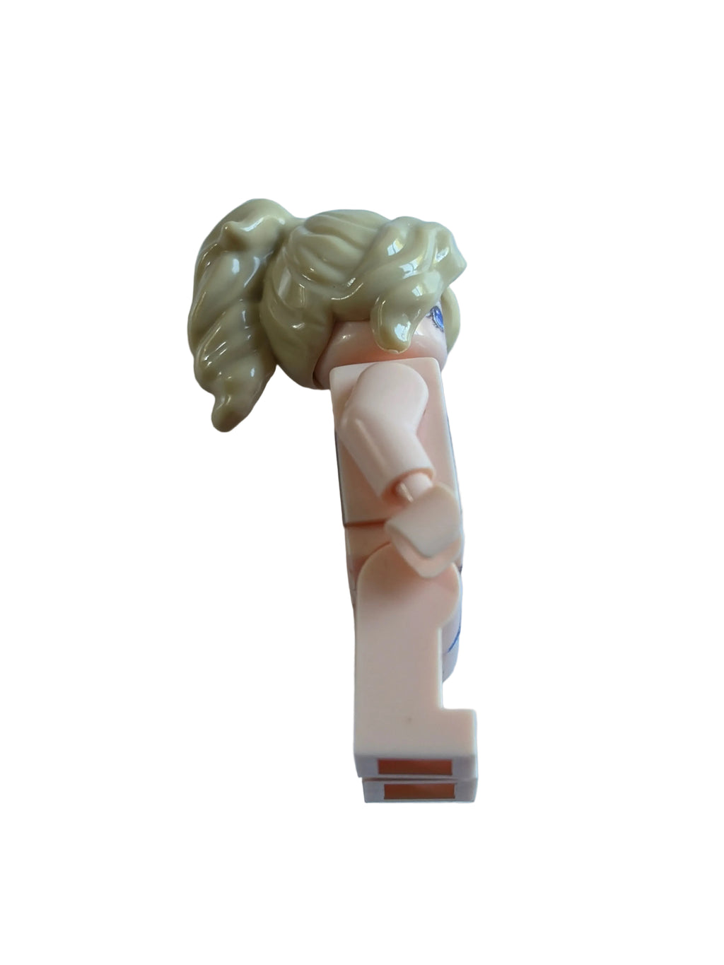 A toy minifigure with blonde hair and a peach-colored body, on a white background.