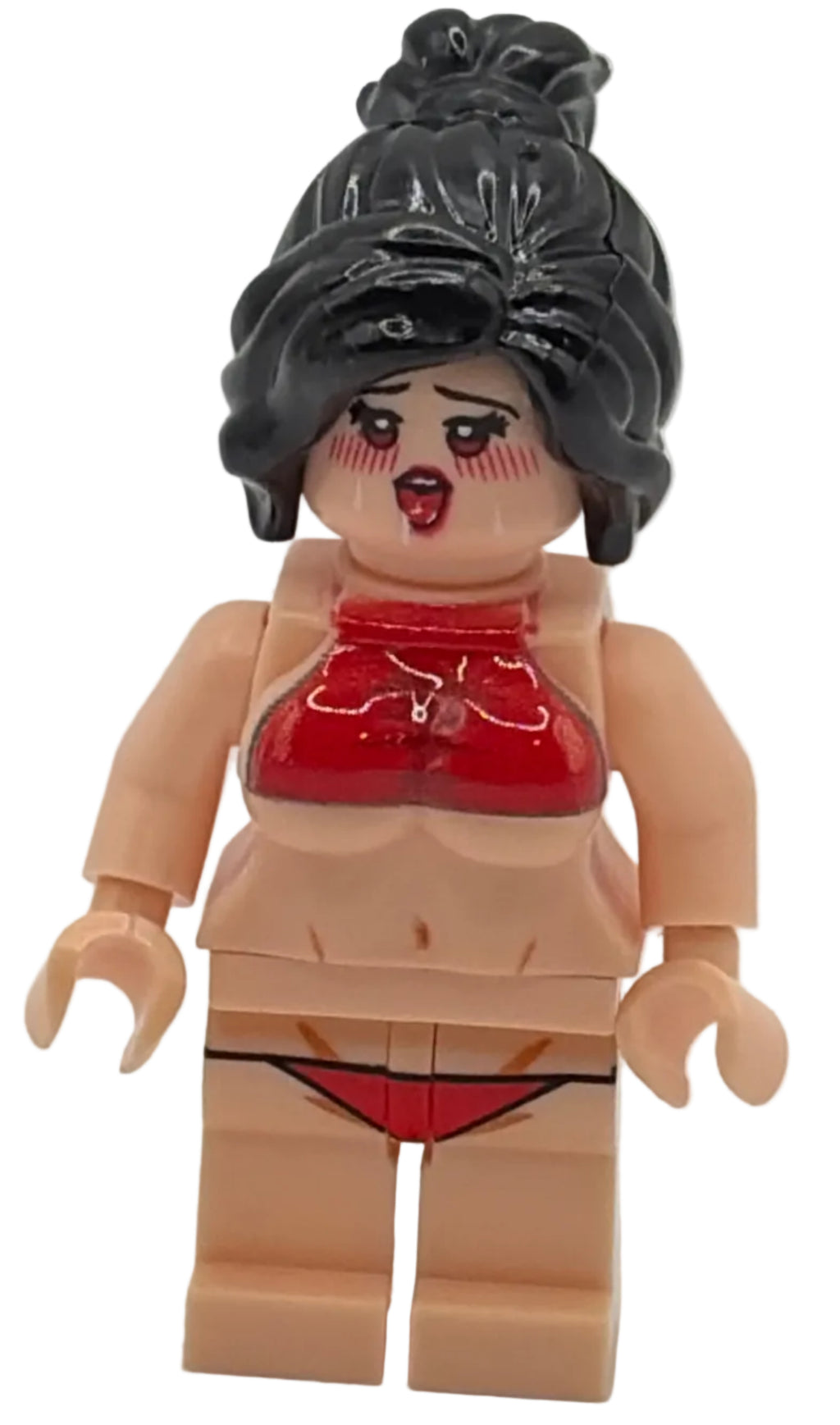 Toy figure with black hair and red face paint on a white background