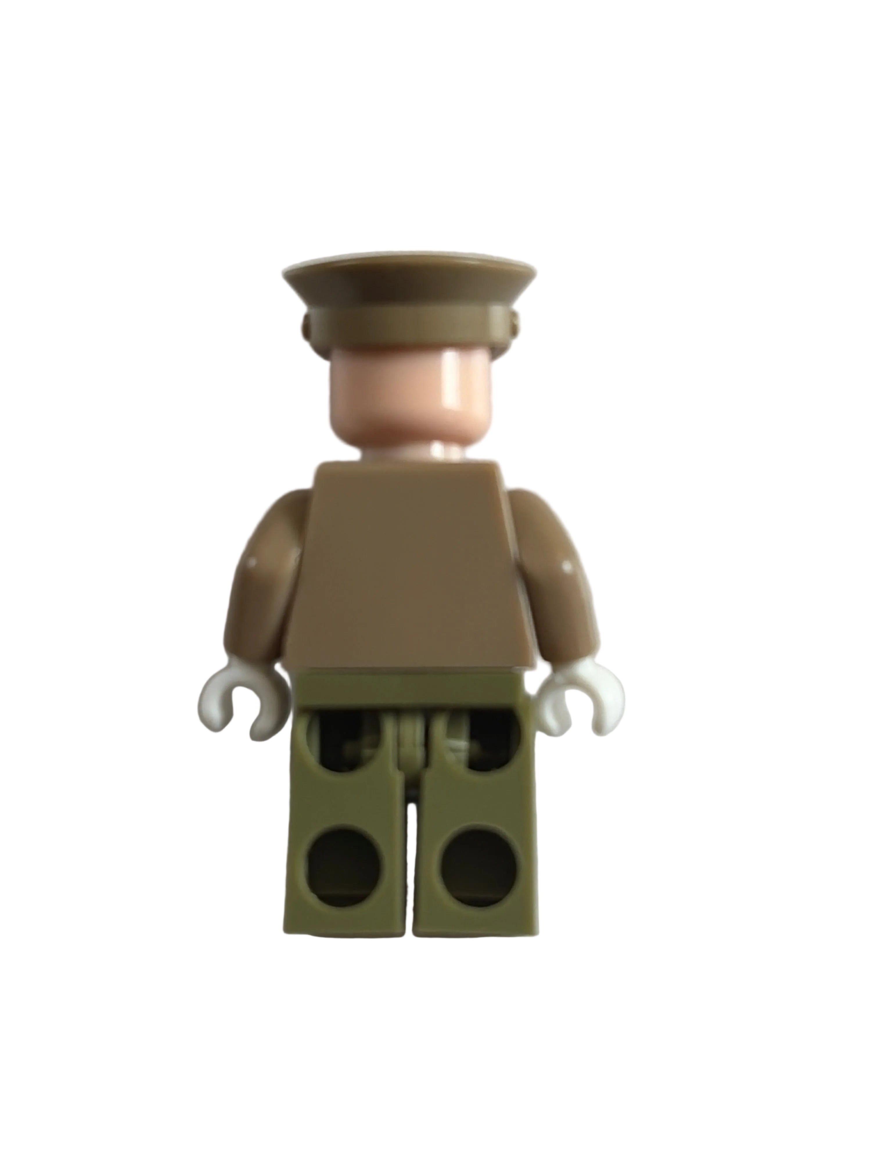 A small toy minifigure torso with a tan head and arms, a light pink neck, and an olive green blocky back, photographed on a plain light background.