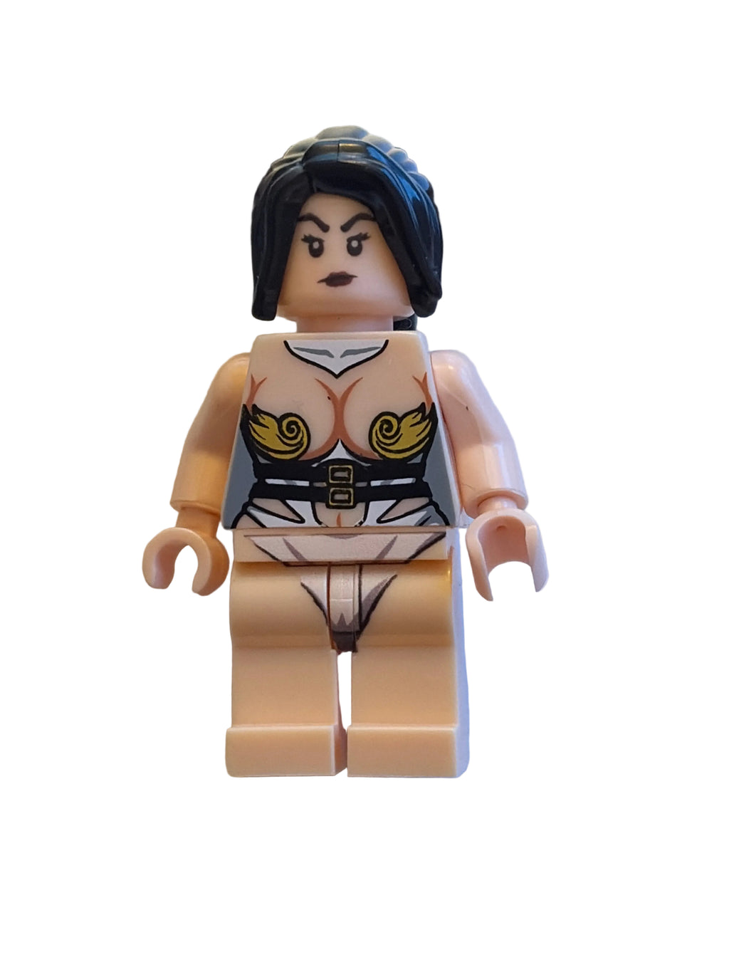 A custom-built female LEGO minifigure with black hair, a printed chest piece featuring gold swirls and black/white details, and a beige torso and legs, shown against a plain light background.