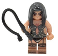 Toy figure with a headband and black strap on a white background