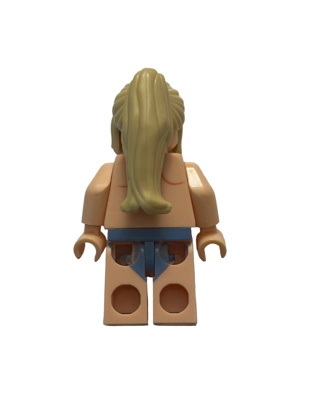 A single toy minifigure torso with long blonde hair, beige skin, and a blue waist piece, photographed on a plain off-white surface.