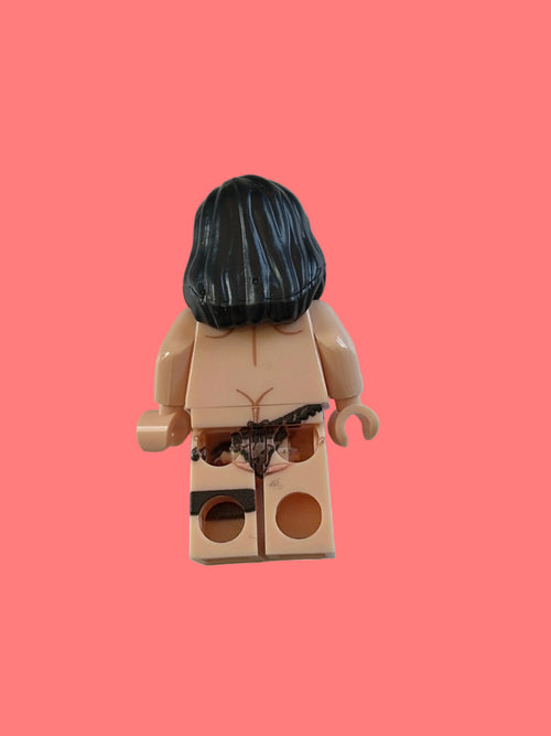 Minifigure with black hair and brown beard on a white background