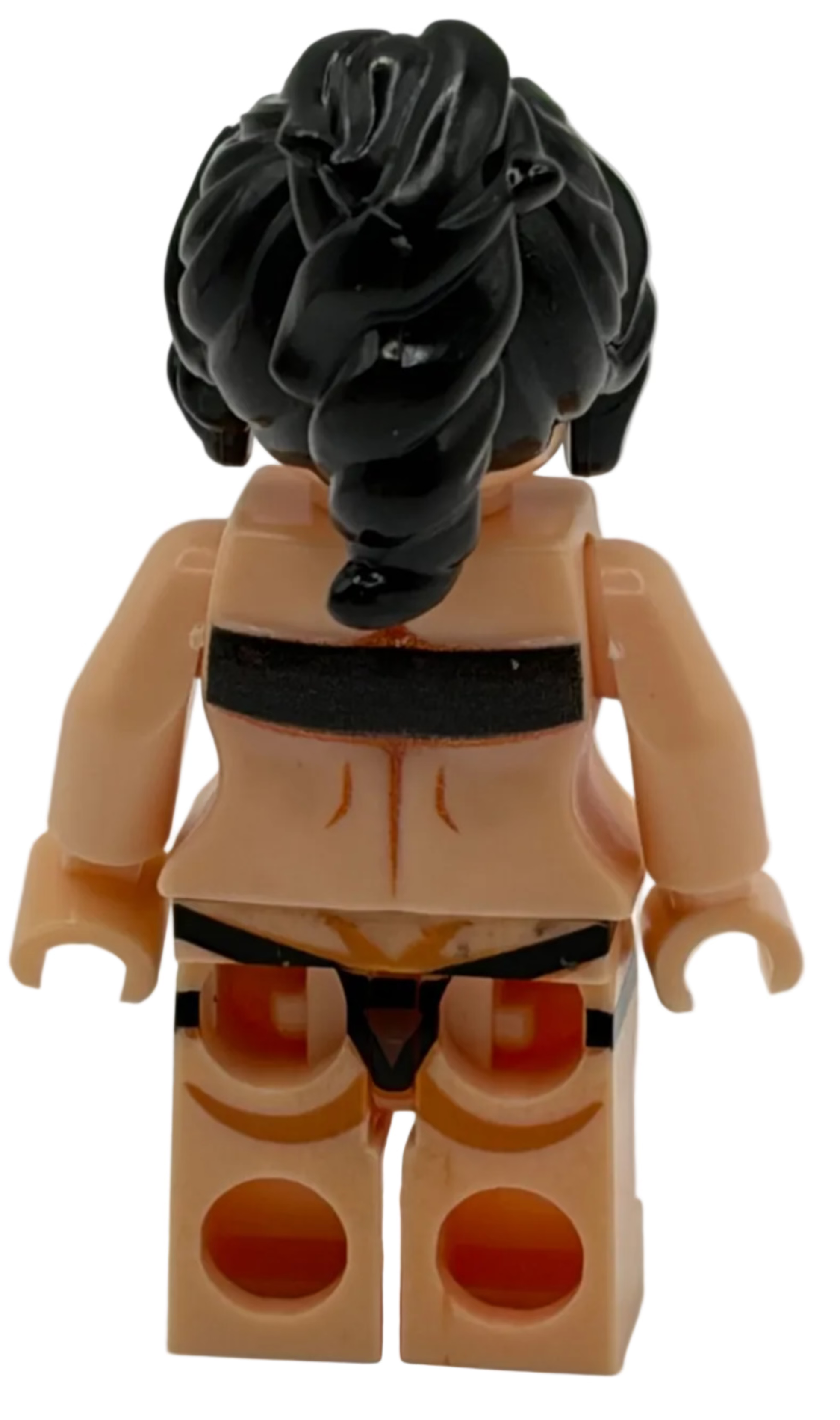 Toy figure with black hair and beige outfit on a white background