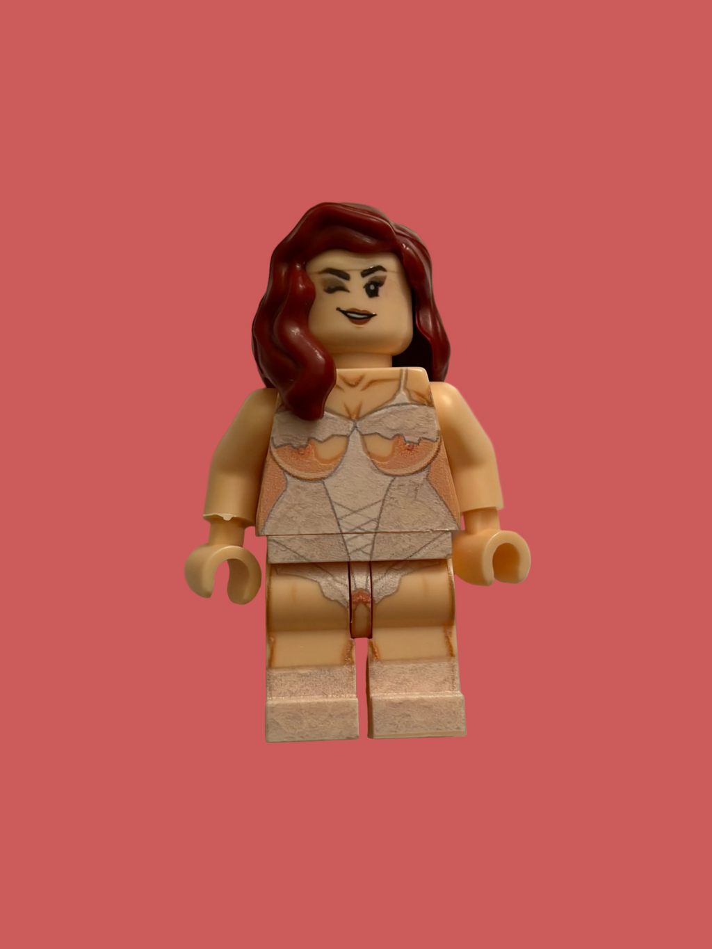 A custom LEGO minifigure of a woman with red hair, featuring a beige torso with printed lace-up lingerie details, set against a plain pink background.