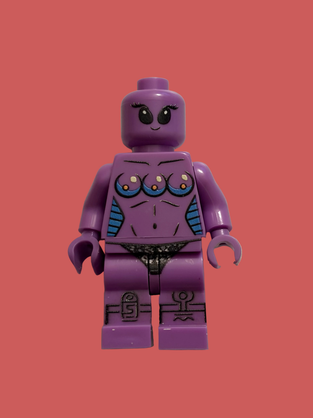 A purple LEGO style minifigure with a stylized female torso, featuring blue and orange details on the chest, black printed facial features, and black patterned details on the legs, standing against a plain beige background.
