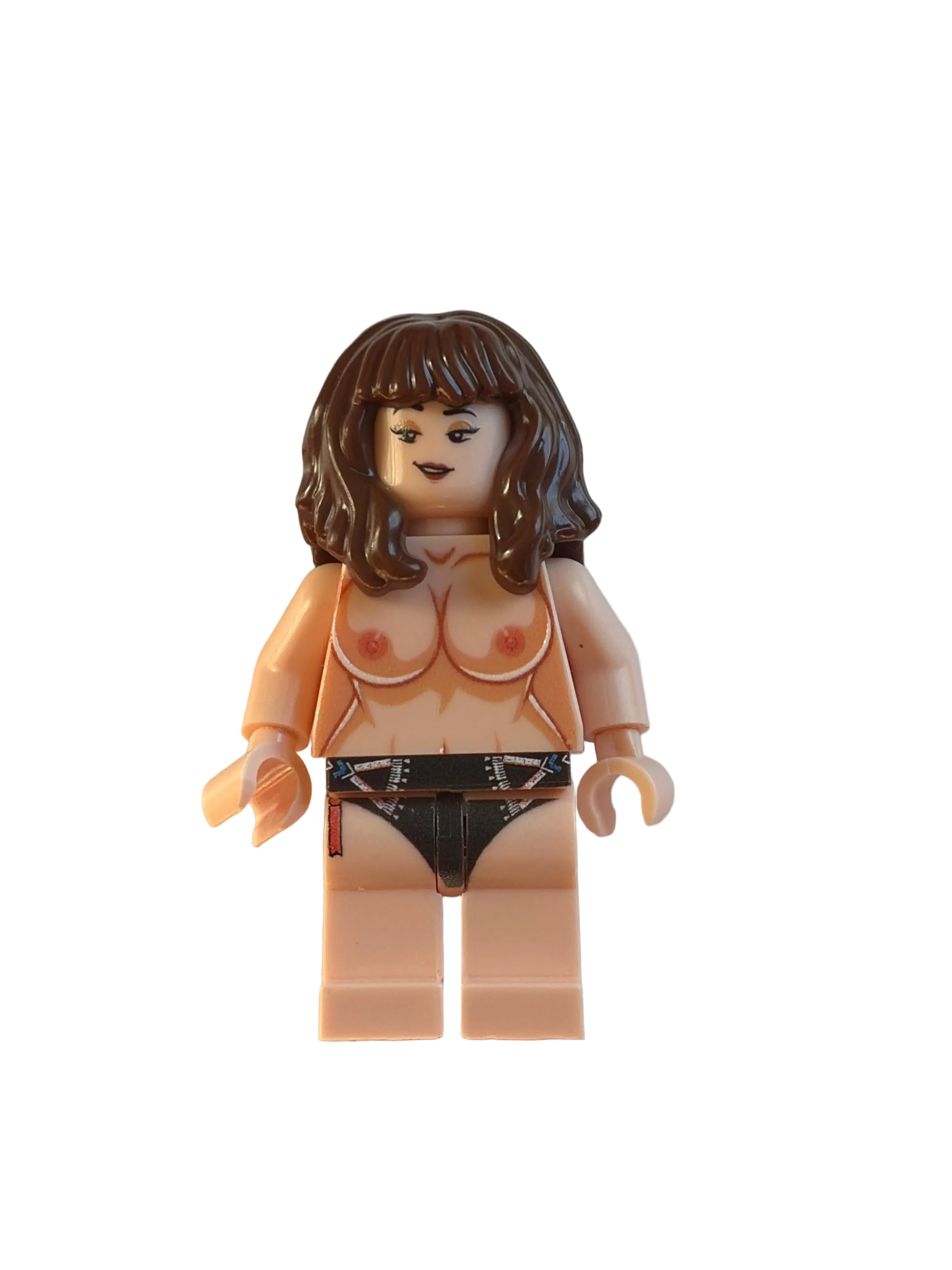 A toy minifigure with brown hair, a beige skin tone, and a black-and-white patterned bikini, photographed on a plain light background.